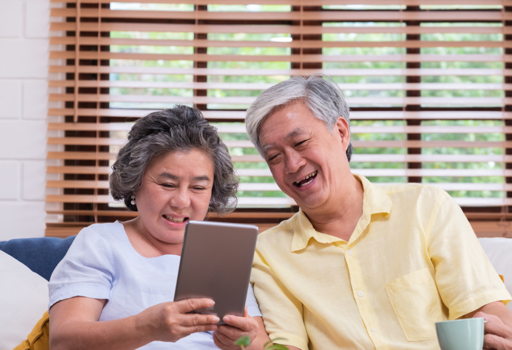 Asian senior couple learn to using table 1024x683