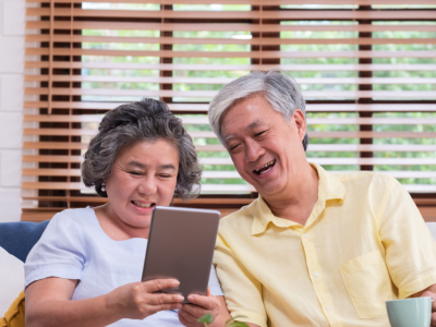 Asian senior couple learn to using table 1024x683